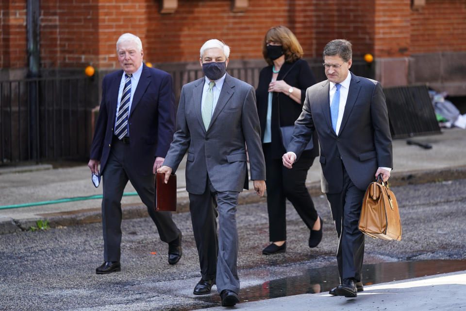 Former Penn State President Graham Spanier walks from the Dauphin County Courthouse in Harrisburg, Pa., after a hearing at Wednesday, May 26, 2021. A judge has upheld the jail sentence of Spanier who was forced out as the school's top administrator after Jerry Sandusky was arrested nearly a decade ago. The judge said Spanier must report to jail on July 9 to begin serving at least two months for endangering the welfare of children, followed by two months of house arrest. (AP Photo/Matt Rourke)