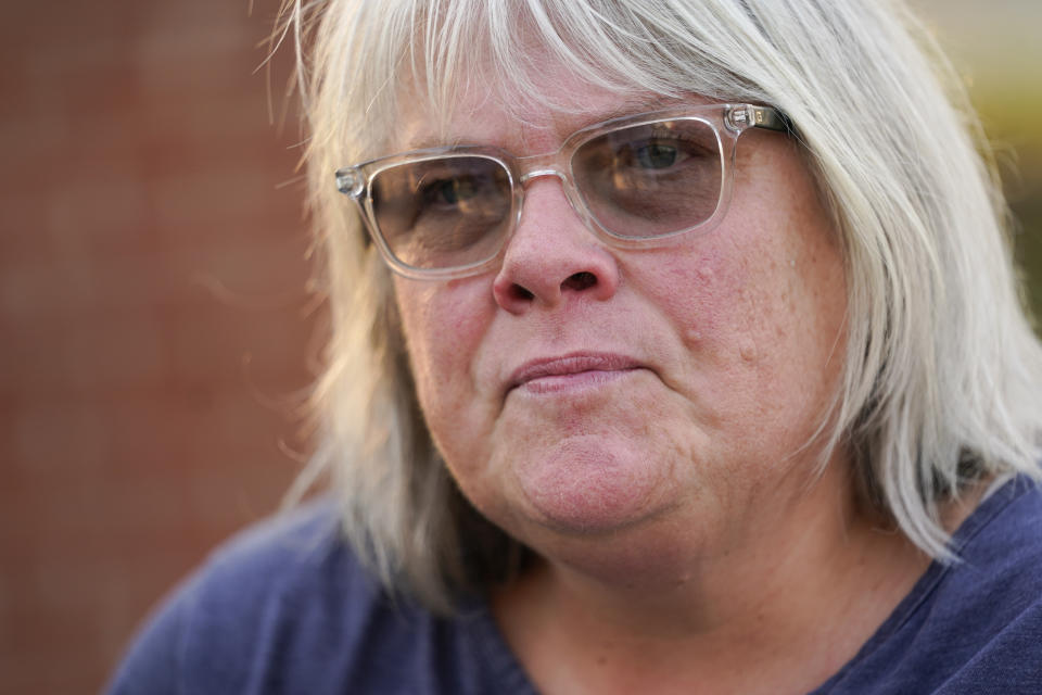 Elyzabeth Marcussen, a former community editor at the Annapolis Capital Gazette newspaper, sits at the Guardians of the First Amendment memorial, which is dedicated to the victims of the newsroom shooting of 2018, Thursday, July 15, 2021, in Annapolis, Md. Marcussen left the paper three years prior to the shooting, but still had friendships with staff, including most of the people killed by Jarrod W. Ramos, the gunman which jury found criminally responsible, rejecting defense attorneys' mental illness arguments, on Thursday. (AP Photo/Julio Cortez)