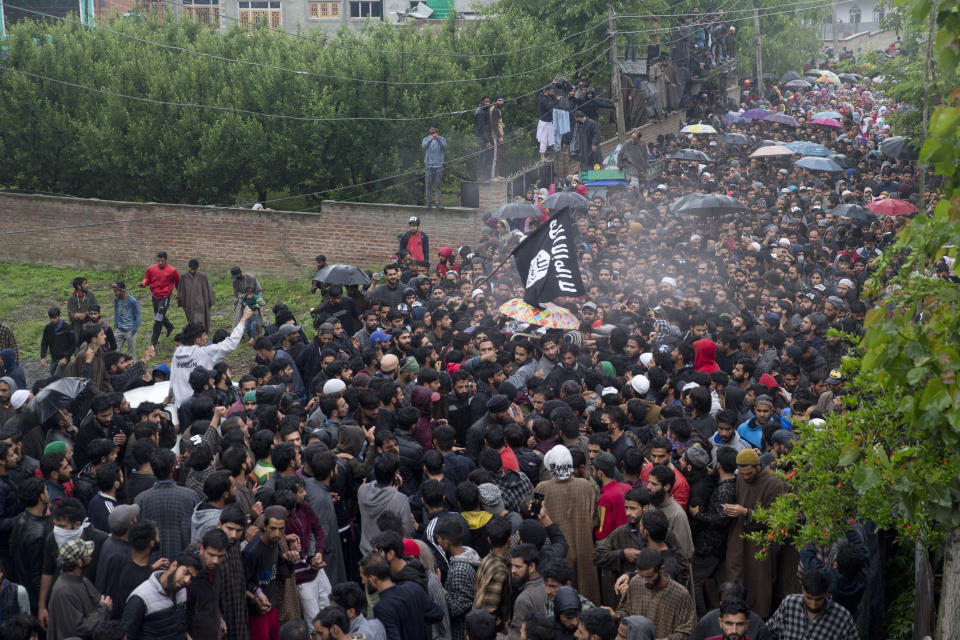 Kashmiri villagers carry the body of Zakir Musa, a top militant commander linked to al-Qaida, as it rains during his funeral procession in Tral, south of Srinagar, Indian controlled Kashmir, Friday, May 24, 2019. Musa was killed Thursday evening in a gunfight after police and soldiers launched a counterinsurgency operation in the southern Tral area, said Col. Rajesh Kalia, an Indian army spokesman. (AP Photo/Dar Yasin)