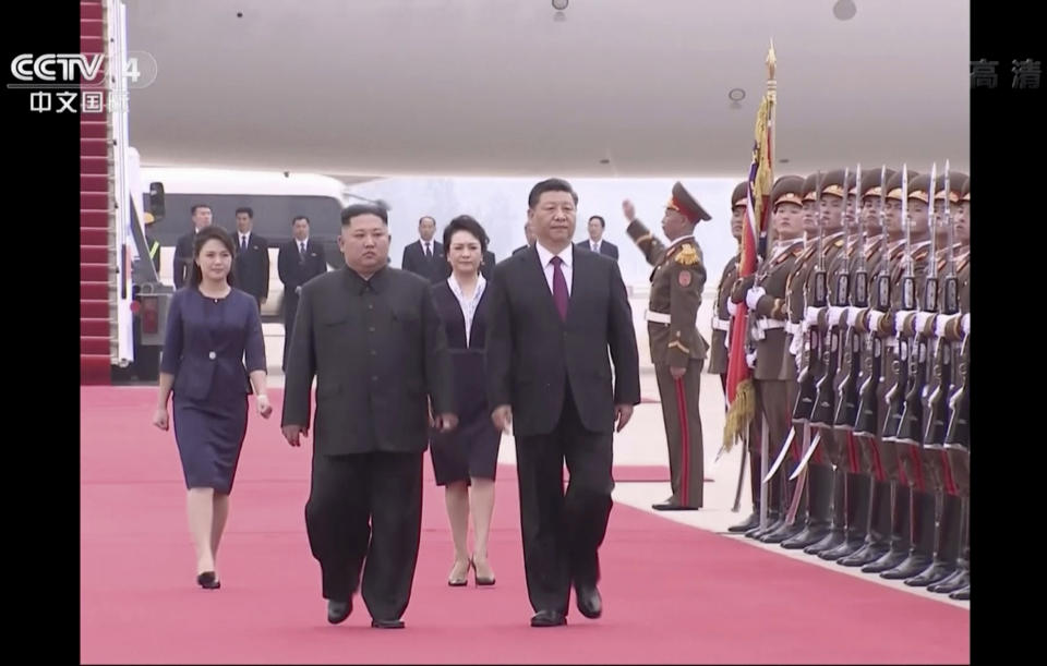 In this image taken from a video footage run by China's CCTV, North Korean leader Kim Jong Un, left, and Chinese President Xi Jinping, right, walk together on Xi's arrival at an airport in Pyongyang, North Korea, Thursday, June 20, 2019. The leaders of China and North Korea met in the North's capital on Thursday, their fifth meeting in 15 months, with stalled nuclear negotiations with Washington expected to be on the agenda. (CCTV via AP)