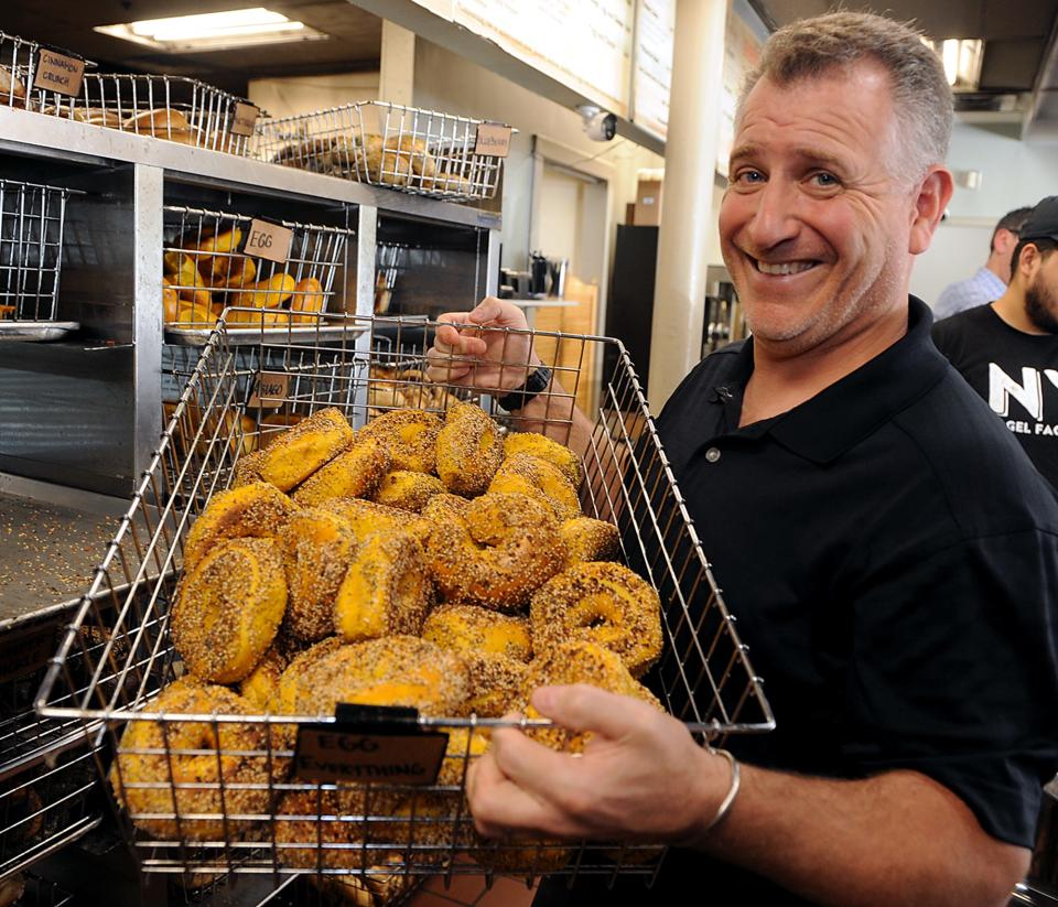 NY Bagel Factory co-owner  Randal Noller with a basket of everything egg bagels, June 14, 2022.