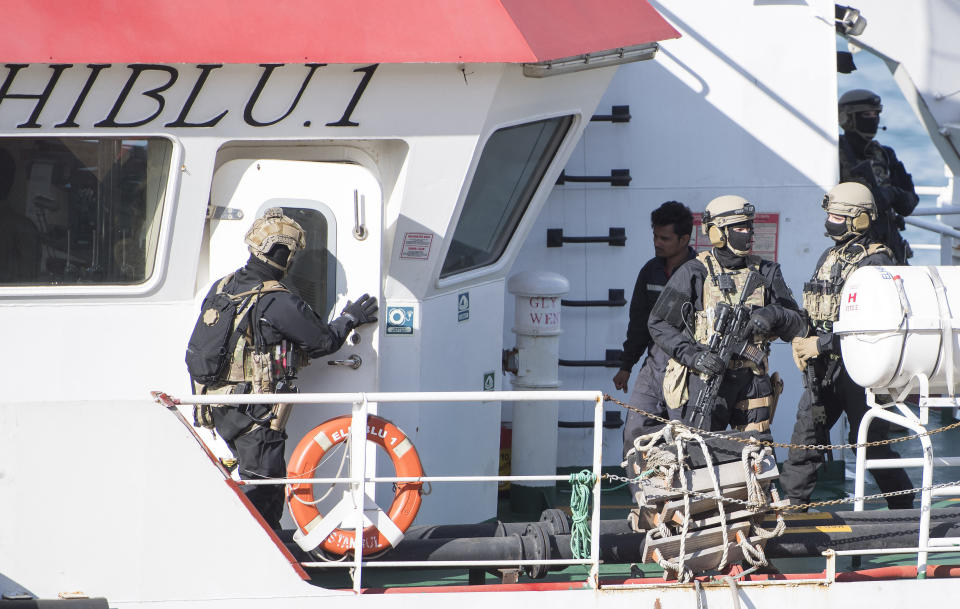 Armed forces stand onboard the Turkish oil tanker El Hiblu 1, which was hijacked by migrants, in Valletta, Malta, Thursday March 28, 2019. A Maltese special operations team boarded a tanker Thursday that had been hijacked by migrants rescued at sea and recaptured control of it before escorting it to a Maltese port. Italy's hard-line interior minister slammed the migrants as pirates but aid groups rejected that label, saying the European Union's policy of sending migrants back to lawless Libya was to blame. (AP Photo/Rene' Rossignaud)