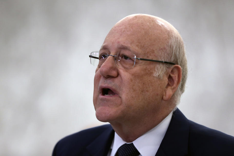 Lebanese Prime Minister-designate Najib Mikati, speaks to journalists after his meeting with Lebanese President Michel Aoun, at the Presidential Palace in Baabda, east of Beirut, Lebanon, Monday, July 26, 2021. Aoun appointed Mikati, a billionaire businessman and former prime minister as the next premier-designate Monday, after Saad Hariri earlier this month gave up attempts to form a Cabinet amid an unprecedented financial meltdown roiling the country. (AP Photo/Bilal Hussein)