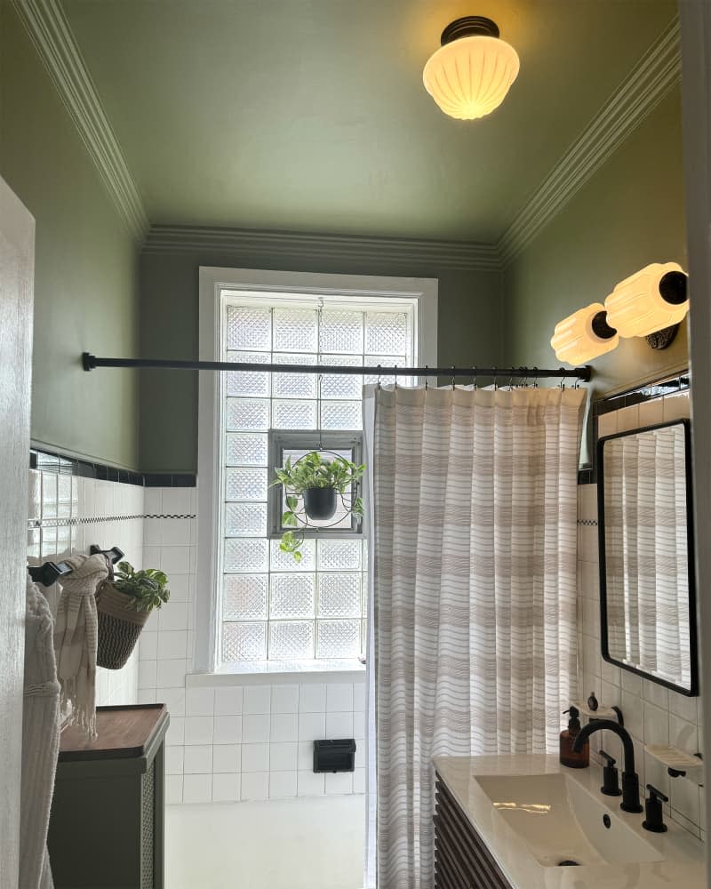 Green painted bathroom after renovation.