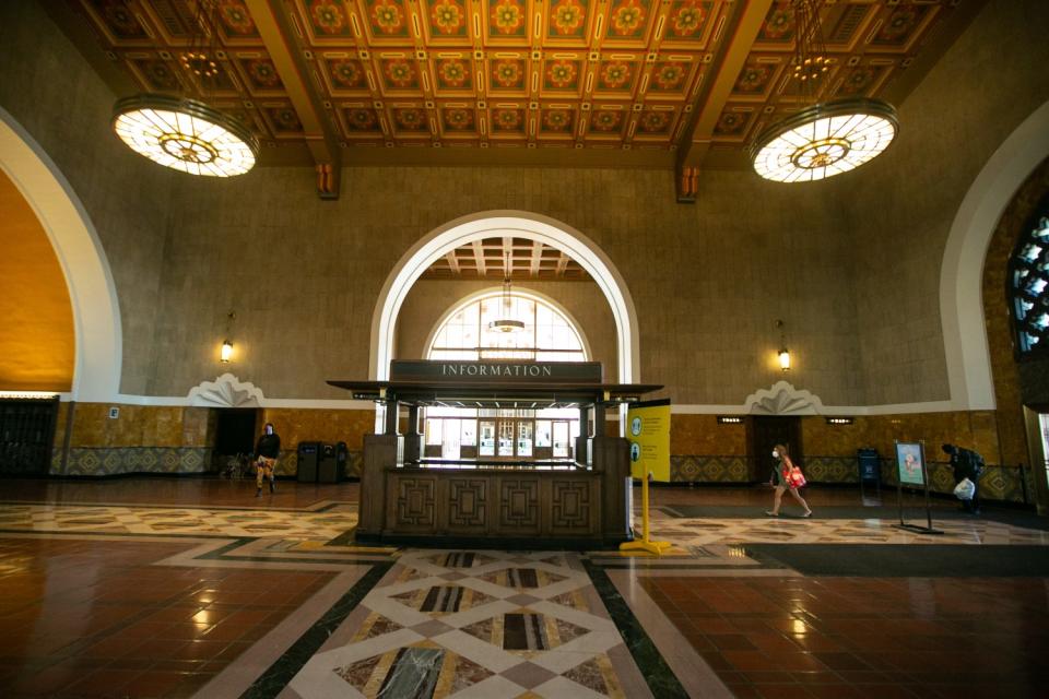 Vivid floor and wall tiles beneath the picturesque, restored ceiling in Union Station's entry vestibule.