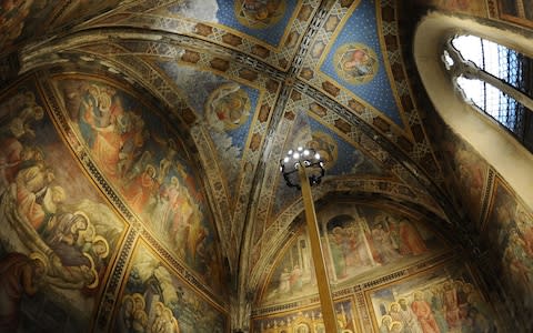 A visitor walk in one of the rooms of the Farmacia di Santa Maria Novell - Credit: AFP/GABRIEL BOUYS