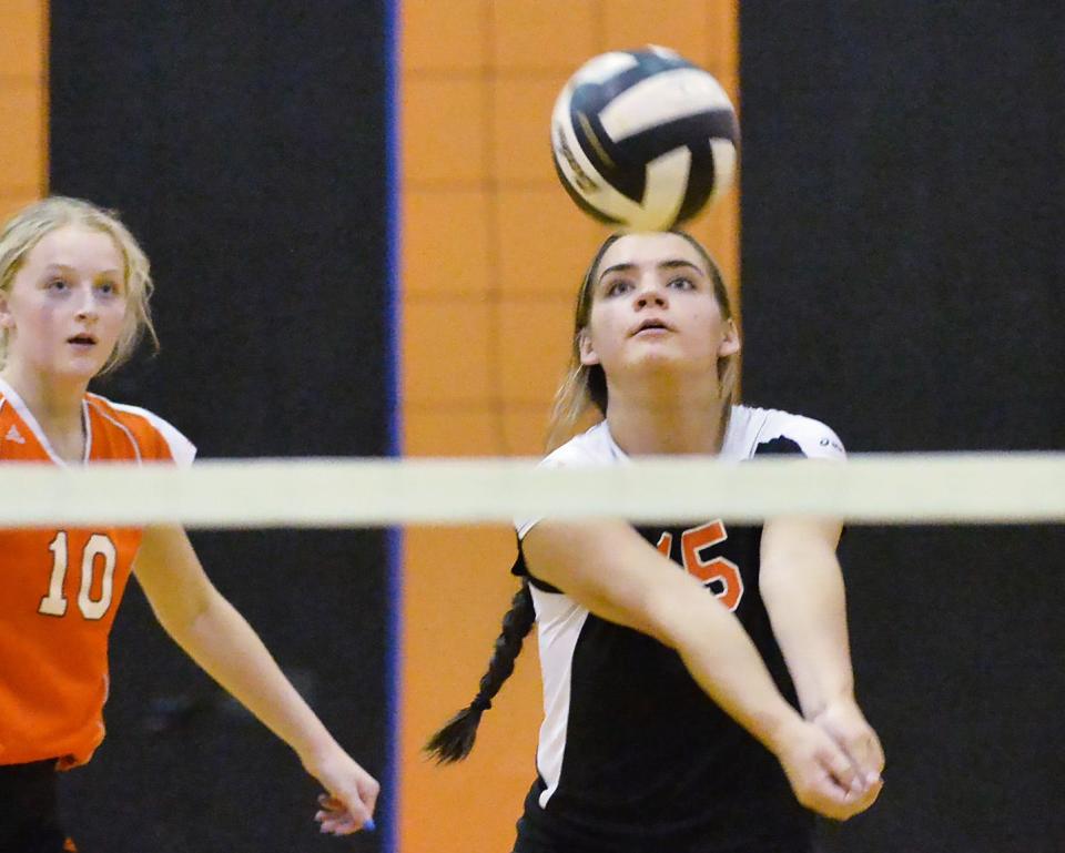 Harbor Creek High School senior Liz Gunther, right, returns a shot against Cathedral Prep as senior teammate Aly Hester, left, backs up the play in Harborcreek Township on Wednesday.
