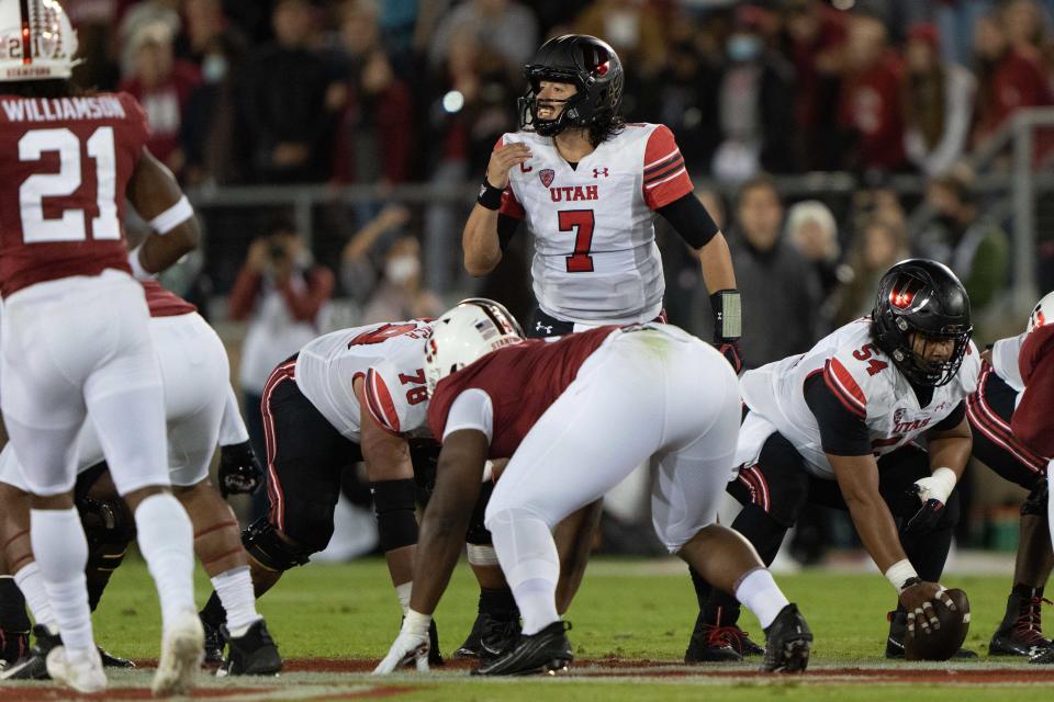 Nov 5, 2021; Stanford, California, USA; Utah Utes quarterback Cameron Rising (7) signals to his teammates during the first quarter against the Stanford Cardinal at Stanford Stadium. Mandatory Credit: Stan Szeto-USA TODAY Sports