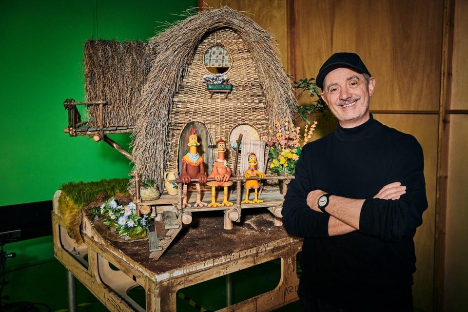 Chicken Run: Dawn of the Nugget director Sam Fell with his Chicken puppets from the film.