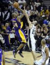 Los Angeles Lakers guard Kobe Bryant (24) shoots over San Antonio Spurs guard Manu Ginobili, of Argentina, during the first half of an NBA basketball game on Friday, April 20, 2012 in San Antonio. (AP Photo/Bahram Mark Sobhani)