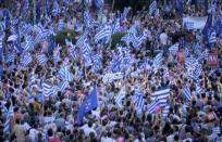 'Yes' supporters wave Greek flags during a pro-Euro rally next to the Panathenean stadium in Athens, Greece, July 3, 2015. REUTERS/Marko Djurica