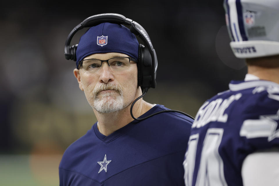 Dallas Cowboys acting head coach Dan Quinn walks the sidelines during the first half of an NFL football game against the New Orleans Saints, Thursday, Dec. 2, 2021, in New Orleans. (AP Photo/Brett Duke)