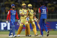 Chennai Super Kings' MS Dhoni, second from left, greets Delhi Capitals' Khaleel Ahmed, right, as Delhi Capitals' captain Rishabh Pant , left, looks on at the end of the Indian Premier League cricket match between Delhi Capitals and Chennai Super Kings in Visakhapatnam, India, Sunday, March. 31, 2024.(AP Photo/ Surjeet Yadav))