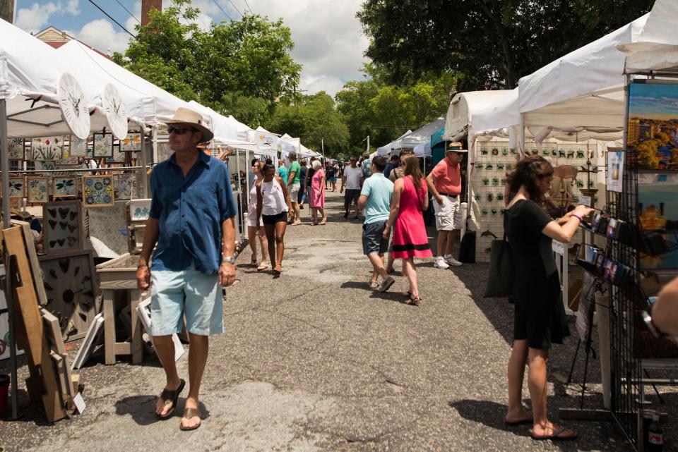 People look at art at the 23rd annual Orange Street ArtsFest in historic downtown Wilmington in 2018