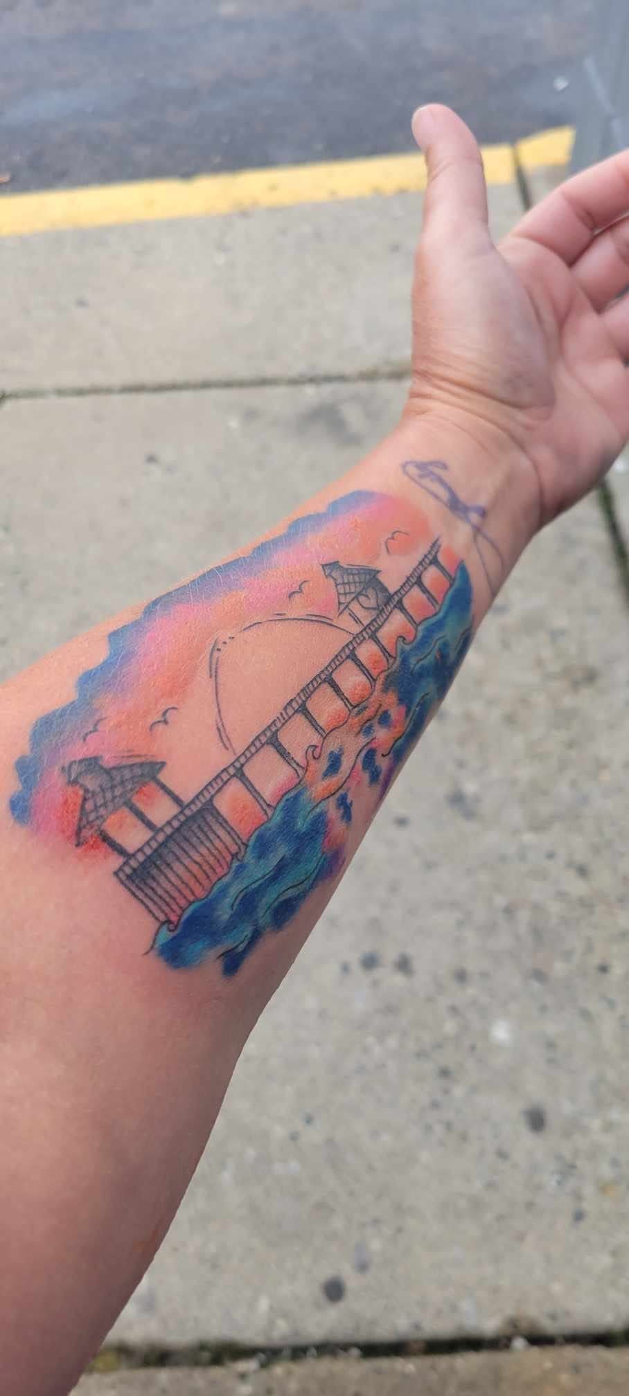 This is a "work in progress" unfinished version of the Fort Myers Beach pier on the left arm of Tracy Wilson Deryckere.