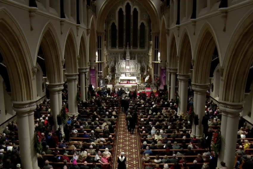 Mourners take communion at Shane MacGowan’s funeral (Facebook)