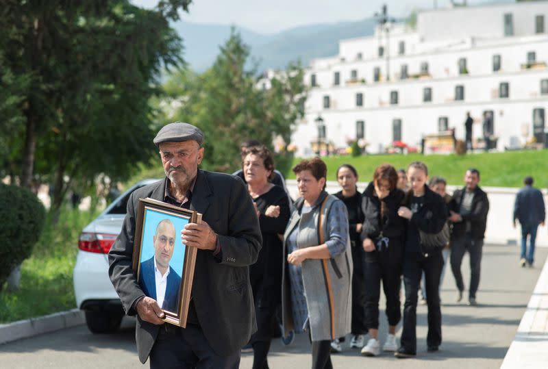 People attend a funeral of Karabakh troops member in Stepanakert