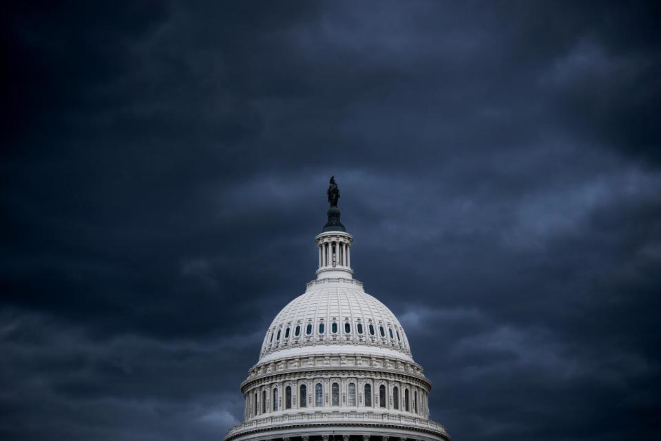 <span>Dark clouds hang over the US Capitol in Washington DC last year.</span><span>Photograph: Bill Clark/CQ-Roll Call via Getty Images</span>