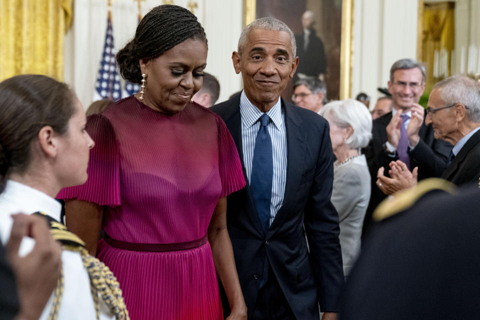 Former President Barack Obama and former first lady Michelle Obama depart after unveiling their official White House portraits during a ceremony in the East Room of the White House, Wednesday, Sept. 7, 2022, in Washington. (AP Photo/Andrew Harnik)