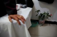 A rose plant is seen in a room at the accommodation where some patients and their family members stay while seeking medical treatments in Beijing, China, October 23, 2015. REUTERS/Kim Kyung-Hoon