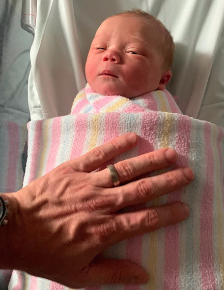 Edwina Bartholomew's daughter Molly Matilda Christie Varcoe wrapped in a hospital blanket