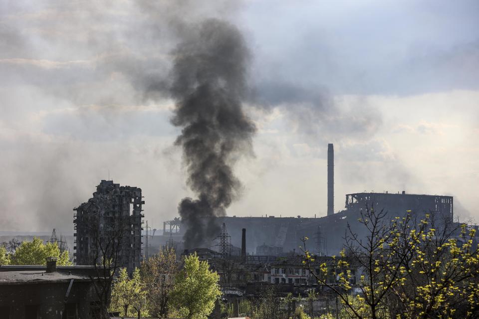 Smoke rises from the Metallurgical Combine Azovstal in Mariupol, in territory under the government of the Donetsk People's Republic, eastern Ukraine, Wednesday, May 4, 2022. / Credit: Alexei Alexandrov / AP