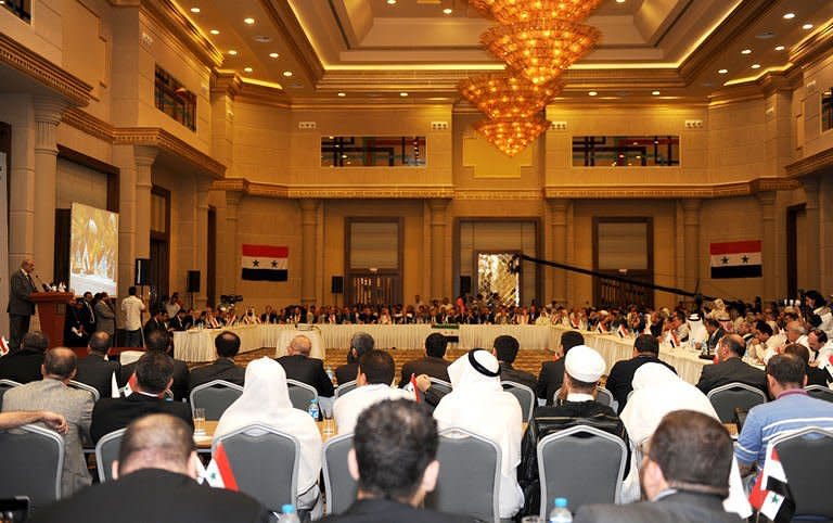 Syrian opposition leader Haitham al-Maleh (L, at podium) speaks in Istanbul. Hundreds of Syrian dissidents debated strategies to oust Bashar al-Assad's regime Saturday in Istanbul as US Secretary of State Hillary Clinton called for a halt to the "brutal" repression of protests