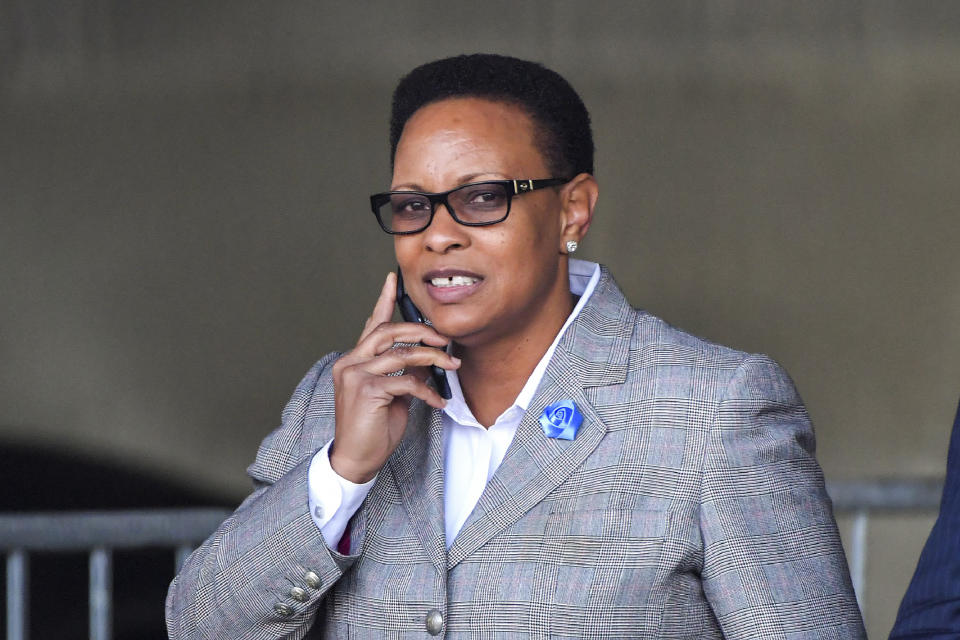 In this Thursday, April 5, 2018, the Rev. Mitzi Bickers walks at the Richard B. Russell Federal Building after her first appearance in federal court in Atlanta. Bickers, a political consultant who was a top aide to former Mayor Kasim Reed is the first person set to go to trial in a long-running federal investigation into corruption at Atlanta City Hall. (Hyosub Shin/Atlanta Journal Constitution via AP)