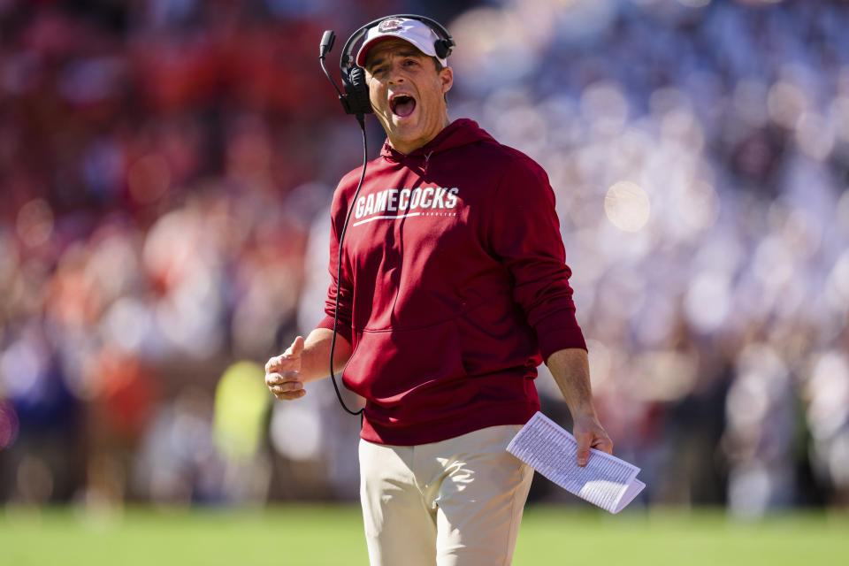 FILE - South Carolina coach Shane Beamer watches during the team's NCAA college football game against Clemson on Nov. 26, 2022, in Clemson, S.C. South Carolina quarterback Spencer Rattler needed answers before deciding on the NFL. He got all the right ones from his teammates and new offensive coordinator Dowell Loggains to stick around for another season. (AP Photo/Jacob Kupferman, File)