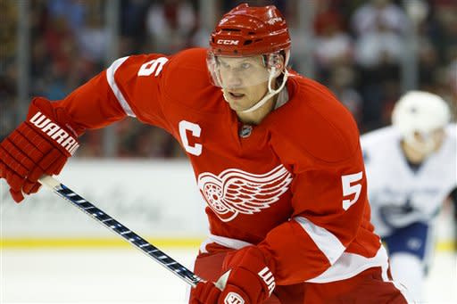 Detroit Red Wings defenseman Nicklas Lidstrom (5) looks onduring in the third period of an NHL hockey game against the Vancouver Canucks in Detroit, Wednesday, Dec. 22, 2010. Detroit defeated Vancouver 5-4 in overtime. (AP Photo/Rick Osentoski)