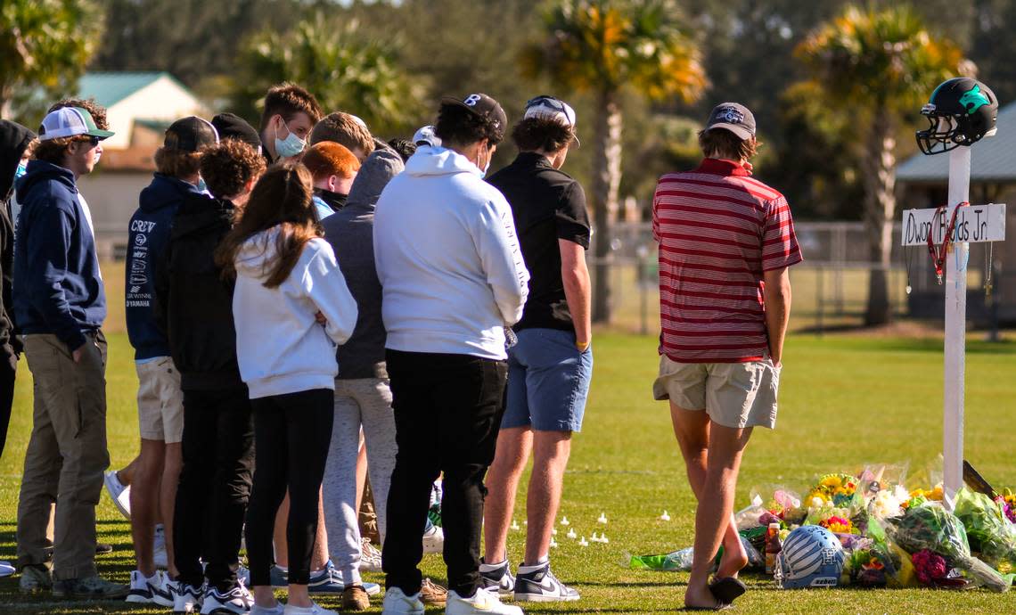 Family and friends gathered at the memorial for Dwon “DJ” Fields Jr. before the start of the public vigil on Sunday, March 7, 2021 at Bluffton High School.