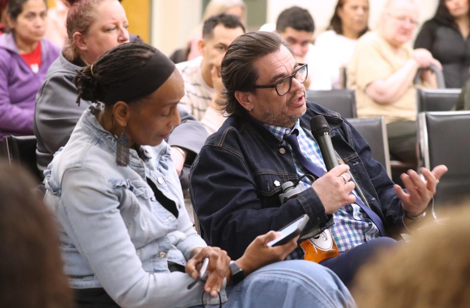 Sharon Jimenez and Dave Cova, resident sof Asbury Terrace, speak during a meeting with Mountco Construction representatives at the Tarrytown Senior Center April 8, 2024.