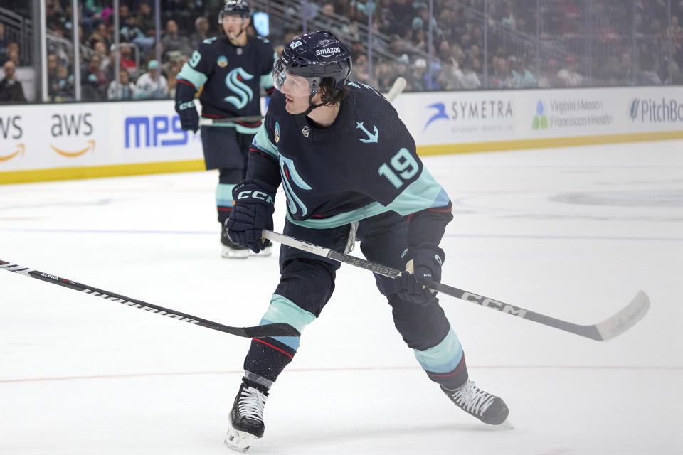 Seattle Kraken left wing Jared McCann (19) watches his puck hit the goal to score on a power play against the Detroit Red Wings during the first period of an NHL hockey game, Monday, Feb. 19, 2024, in Seattle. (AP Photo/John Froschauer)