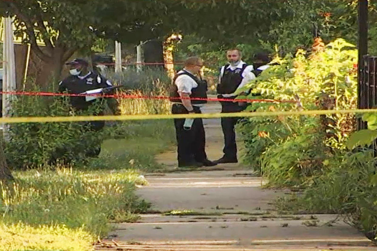 Police officers inspect the scene of a shooting in Chicago's Englewood neighborhood on June 15, 2021. (via NBC Chicago)