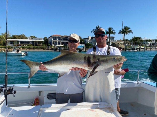 On a trip with Black Dog Fishing Charter, Richard Murdock (left) caught this monster, 60-pound cobia using a Spanish sardine on a circle hook. Mate Andrew Wooten is giving Murdock a hand holding up the behemoth.