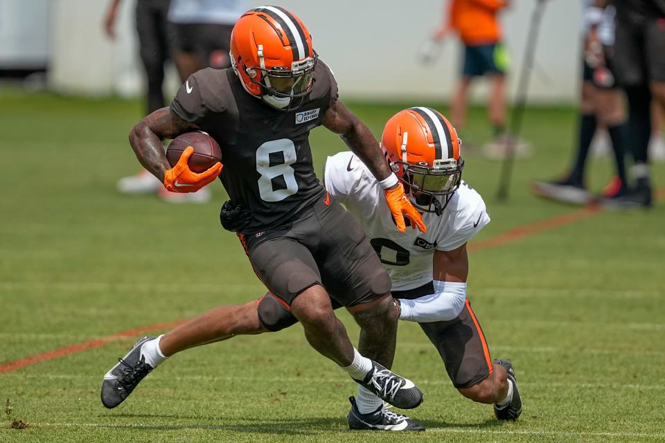 Cleveland Browns wide receiver Elijah Moore runs drills with cornerback Greg Newsome II at the team's training camp on July 29 in White Sulphur Springs, W.Va.