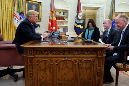 U.S. President Donald Trump sits for an exclusive interview with Reuters journalists Roberta Rampton, Jeff Mason and Steve Holland in the Oval Office at the White House in Washington, U.S. December 11, 2018. REUTERS/Jonathan Ernst