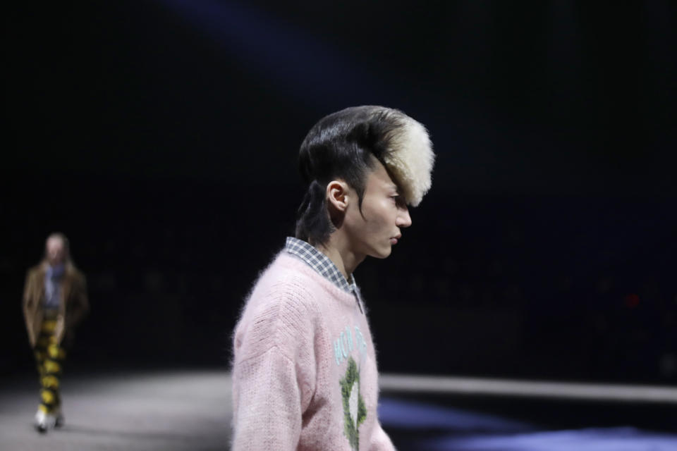 A model wears a creation as part of the Gucci men's Fall-Winter 2020/21 collection, that was presented in Milan, Italy, Tuesday, Jan. 14, 2020. (AP Photo/Luca Bruno)