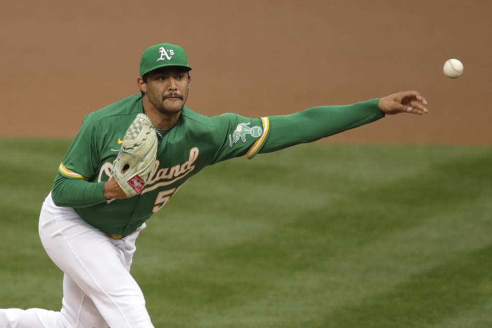 Oakland Athletics pitcher Sean Manaea works against the Texas Rangers in the first inning of a baseball game Wednesday, Aug. 5, 2020, in Oakland, Calif. (AP Photo/Ben Margot)