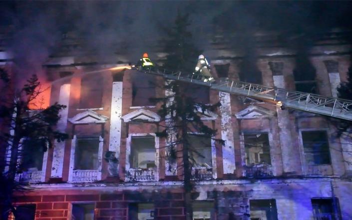 Firefighters work at a site of a building damaged by a Russian missile strike in Mykolaiv - STATE EMERGENCY SERVICE OF UKRAINE/via REUTERS