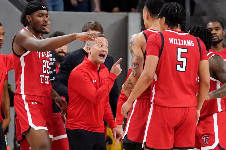 Texas Tech head coach Grant McCasland talks with team during a timeout against the Baylor during the Big 12 basketball game, Tuesday, Feb. 6, 2024, in Waco, Texas.