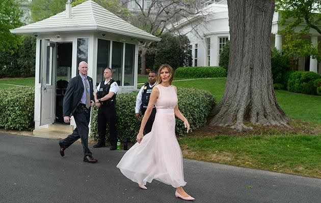 Melania looked radiant in a light pink maxi dress. Photo: Getty