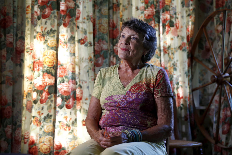 In this July 29, 2019, photo, Susan Ankenbrand speaks during an interview in her home in Ferguson, Mo. Ankenbrand moved to Ferguson in 1975 and served for 16 years as a city council member. She admits race relations are sometimes strained but says that she isn't giving up on Ferguson, that the community has meant too much to her. (AP Photo/Jeff Roberson)