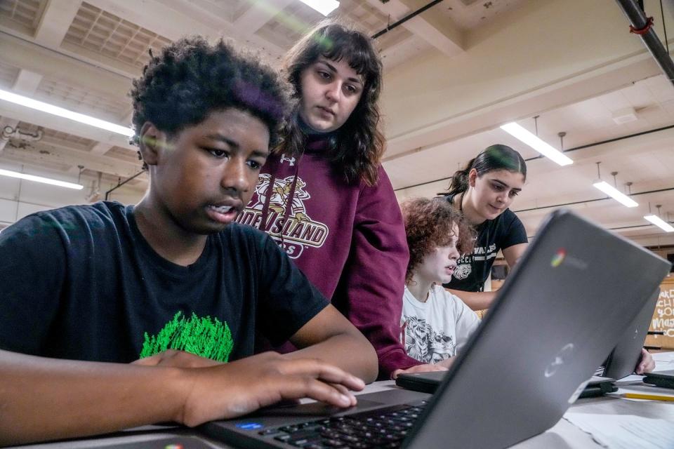 From left, student Santiago Russell, tutor Alexis Sousa, student Nadia Paquette and tutor Jordan Petrucci participate in a Saturday tutoring session at Nathanael Greene Middle School in Providence. Since its inception, the program has grown to include paid tutors from area colleges who are recruited by the nonprofit group Coaching4Change.