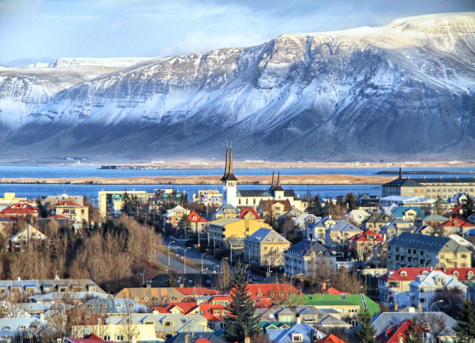 <p>And to top it all off, the cityscapes are adorable and picturesque, too. Here, colorful houses in Reykjavik (the country's coastal capitol) pop against the snow-capped mountains in the distance.</p>