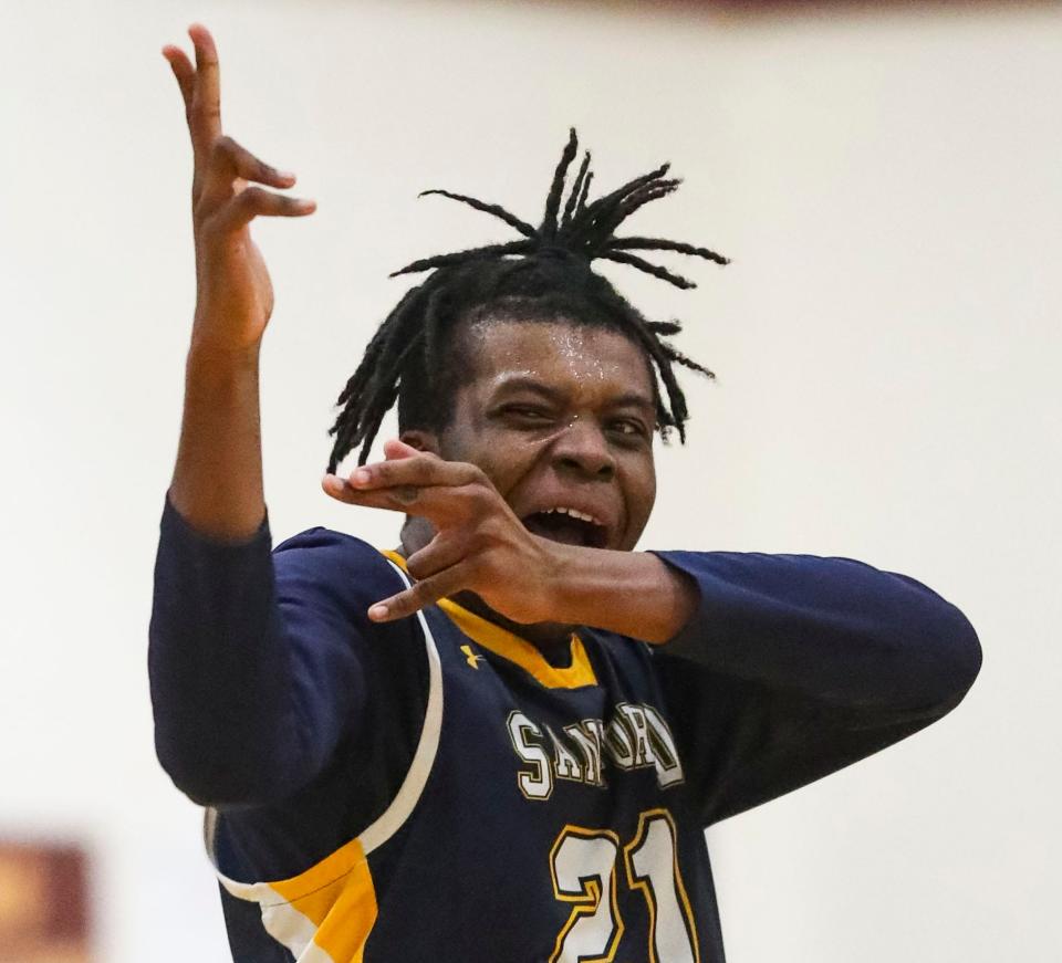 Sanford's Stephen Conway lets loose after a three-pointer in the second half of Sanford's 58-51 win at the St. E Center, Friday, Feb. 16, 2024.