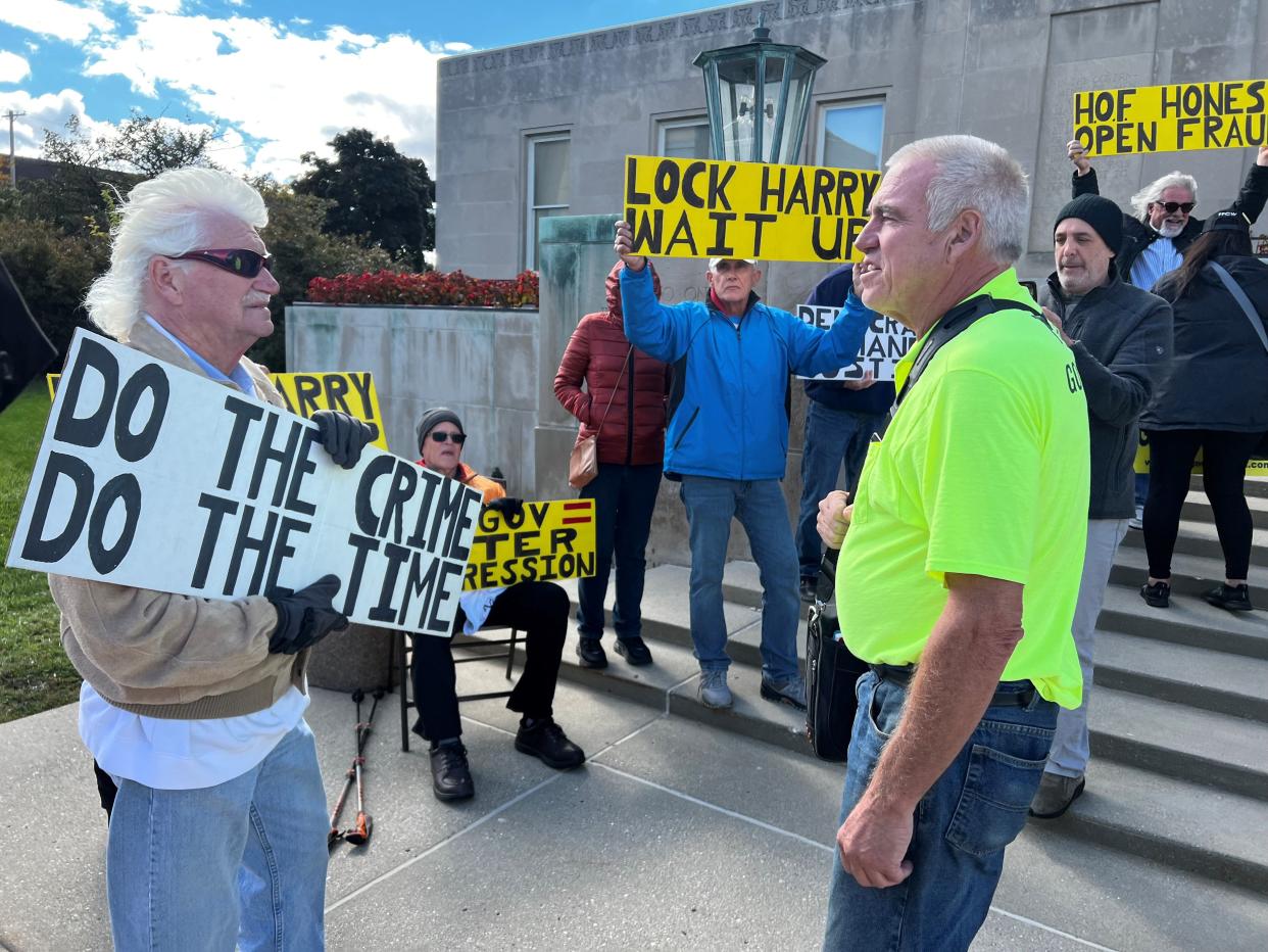 Harry Wait, right, confronts a group of people protesting Wait ahead of a court hearing in Racine County. Wait, of Union Grove, is charged with election fraud after he purposefully requested other people's ballots to prove voter fraud is possible.