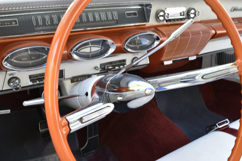 Check out the instrument panel, and that steering wheel.