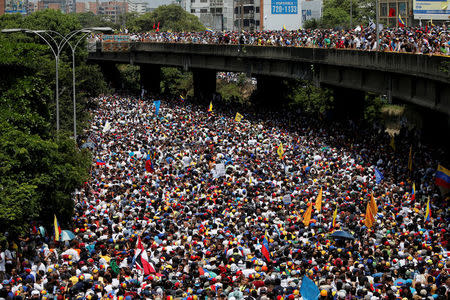 Demonstrators march during the so-called "mother of all marches" against Venezuela's President Nicolas Maduro in Caracas, Venezuela, April 19, 2017. REUTERS/Carlos Garcia Rawlins/Files