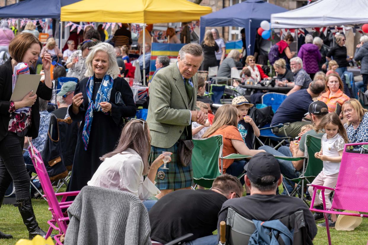 Sandy Manson, Lord-Lieutenant of Aberdeenshire, meeting party-goers at the Coronation Big Lunch in Ballater (Michal Wachucik/Abermedia/Eden Project)